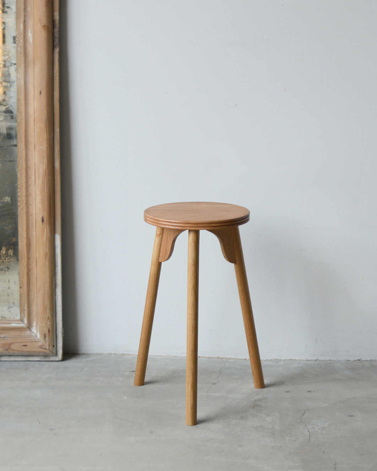 THREE-LEGGED STOOL