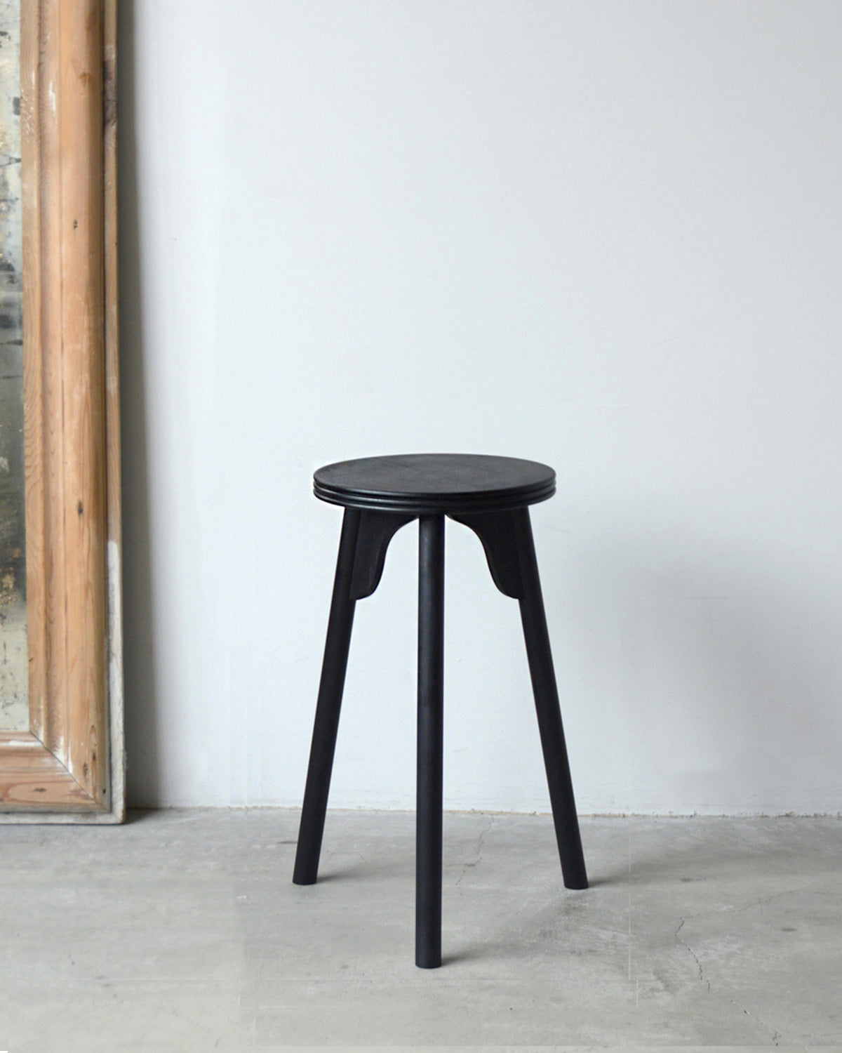 THREE-LEGGED STOOL