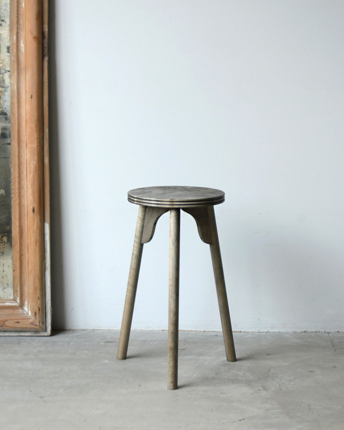 THREE-LEGGED STOOL